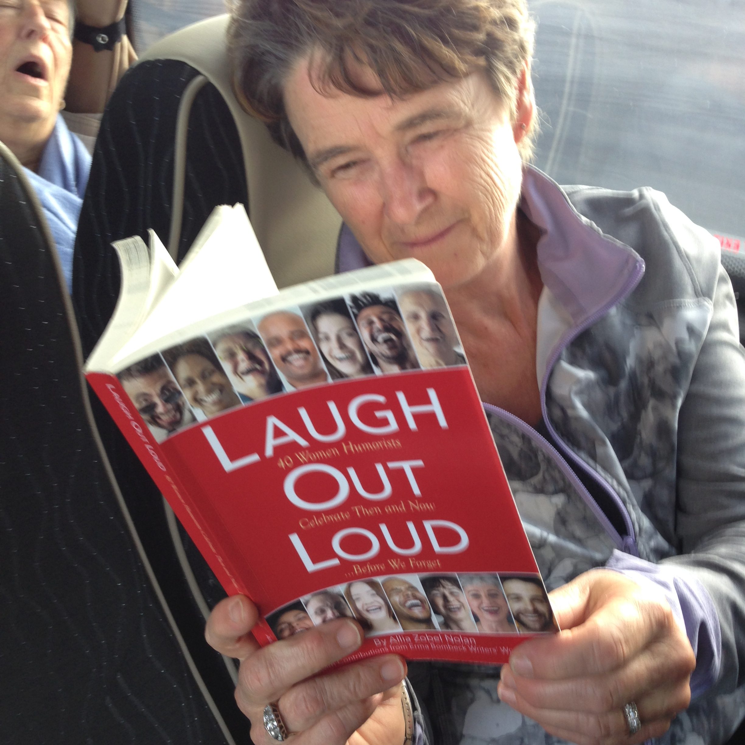 smiling woman reading book