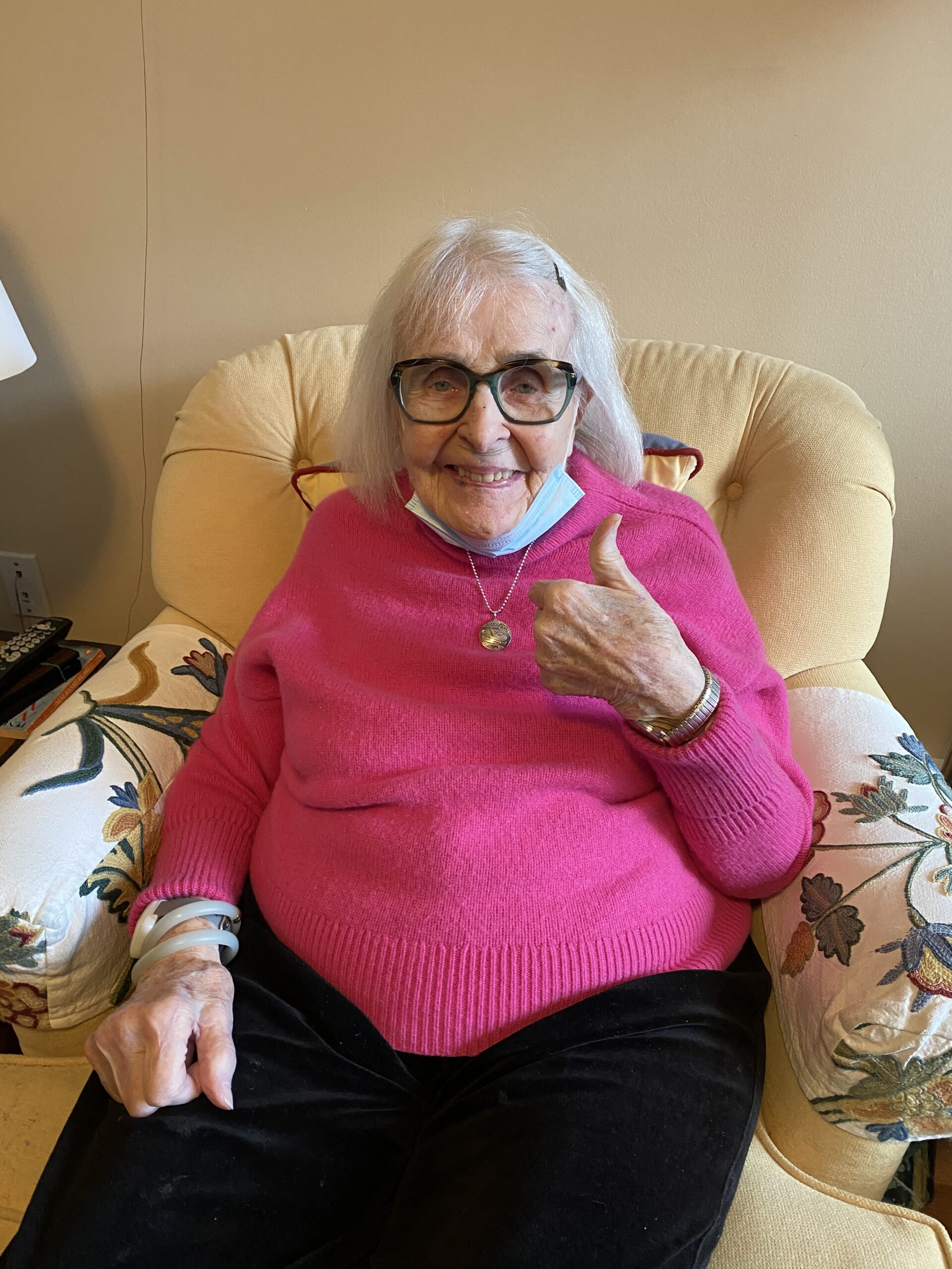 alt="100 year old woman giving the thumbs up"