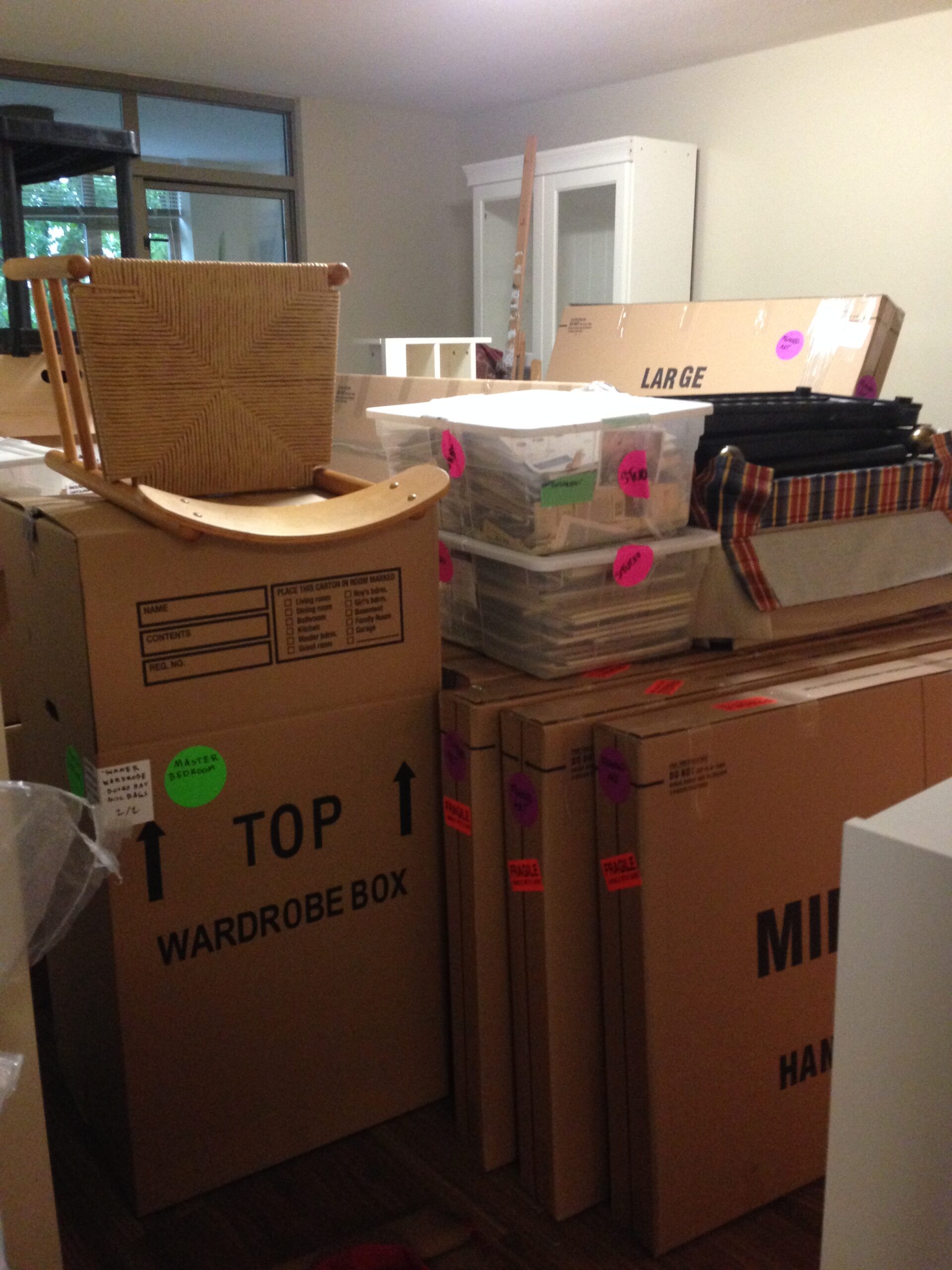 Stacks of cardboard and plastic moving boxes