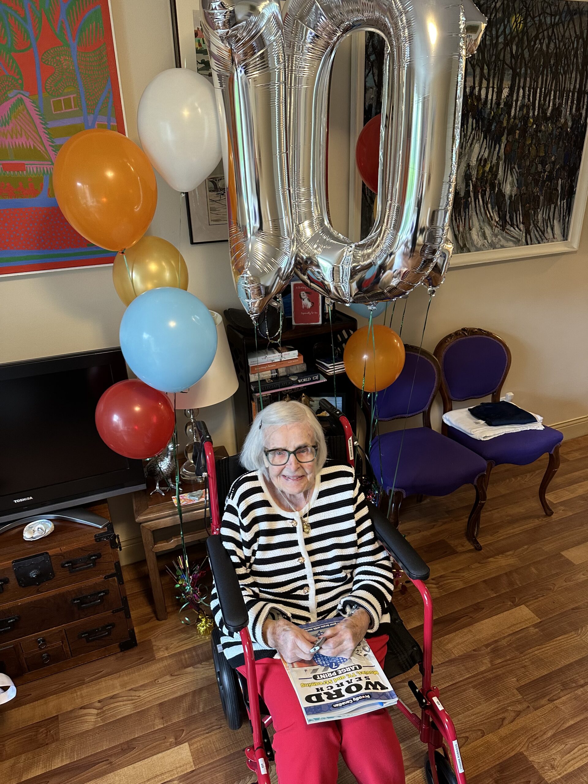 word search book and celebratory balloons