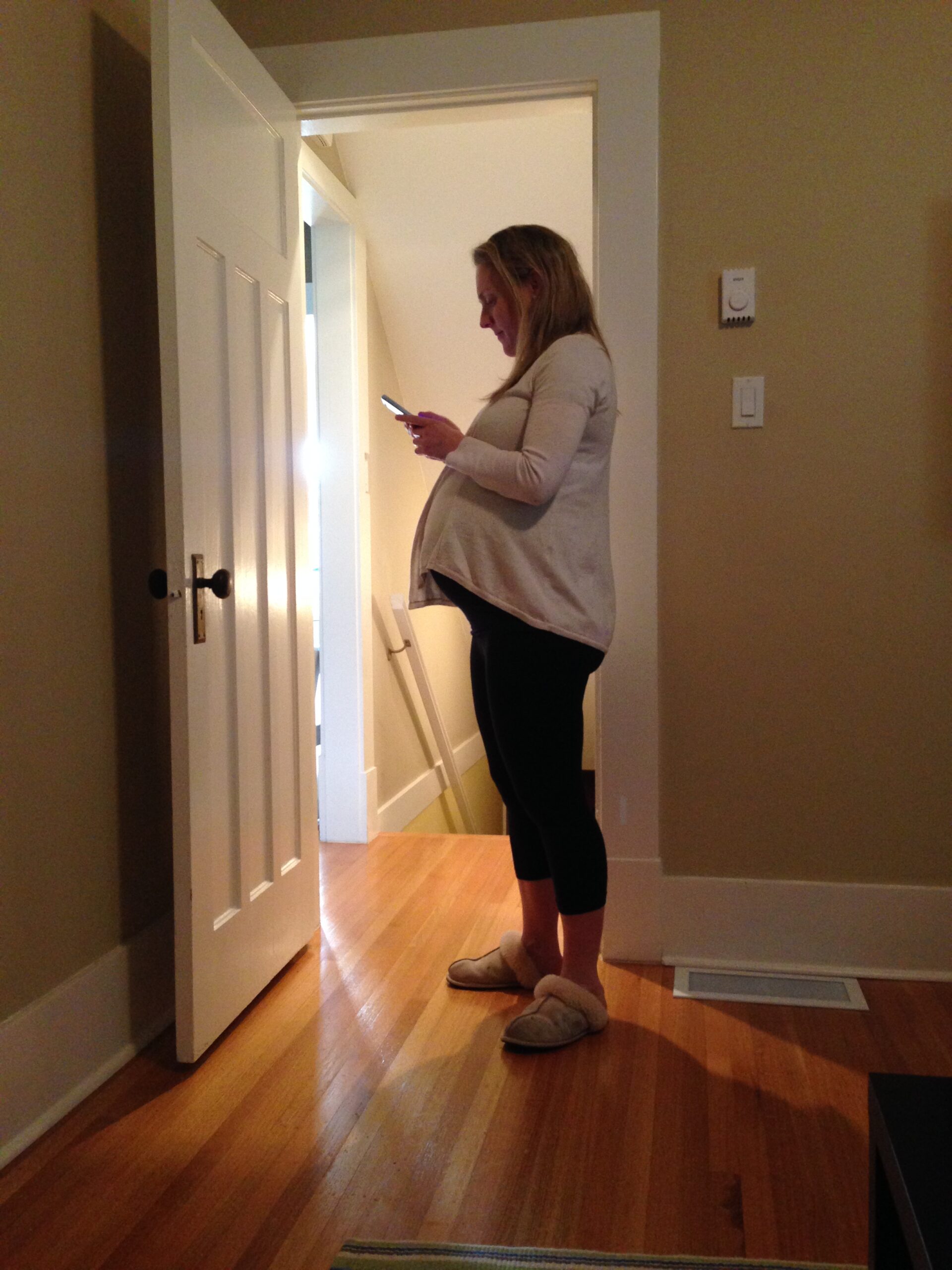 pregnant woman sideways in doorway