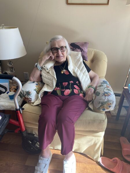 Elderly woman reposed in chair