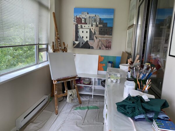 artist's studio with empty canvas and easel