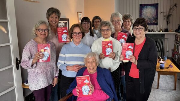 Group of women holding books